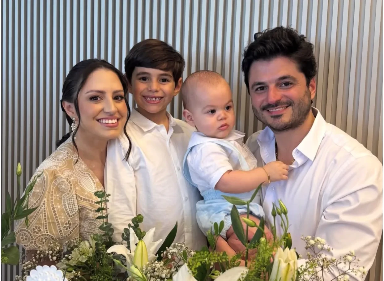 José, filho de Raíssa e Odmar Feitosa Filho, recebe o sacramento do batismo